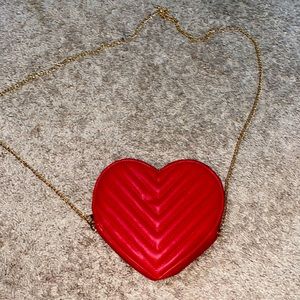Beautiful heart shaped purse with a gold chain